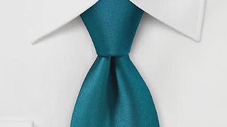 La Cravate Turquoise : Un Symbole d’Ouverture et de Détermination